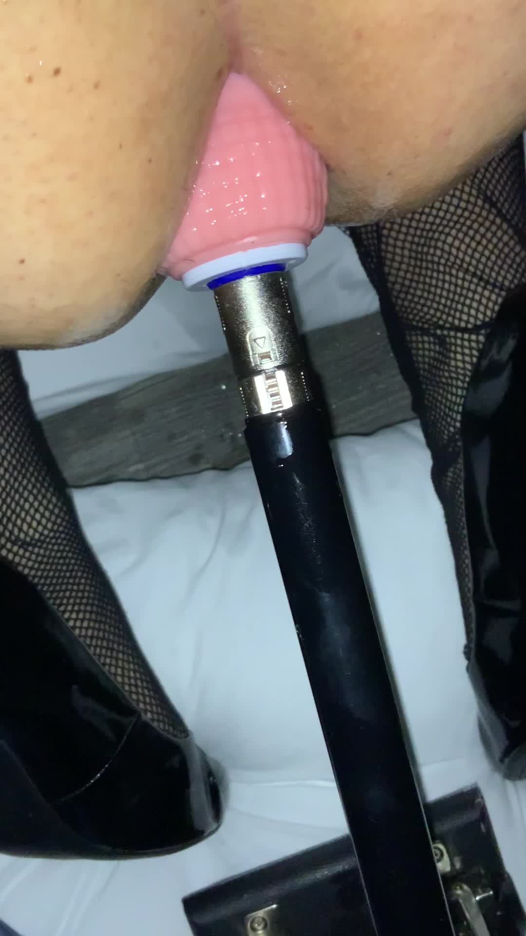 Slut playing with fuck machine in her tight hole